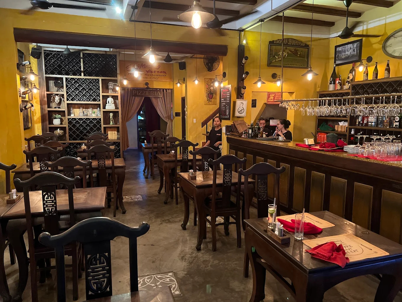 The open kitchen and friendly atmosphere create a cozy setting for couples and small groups